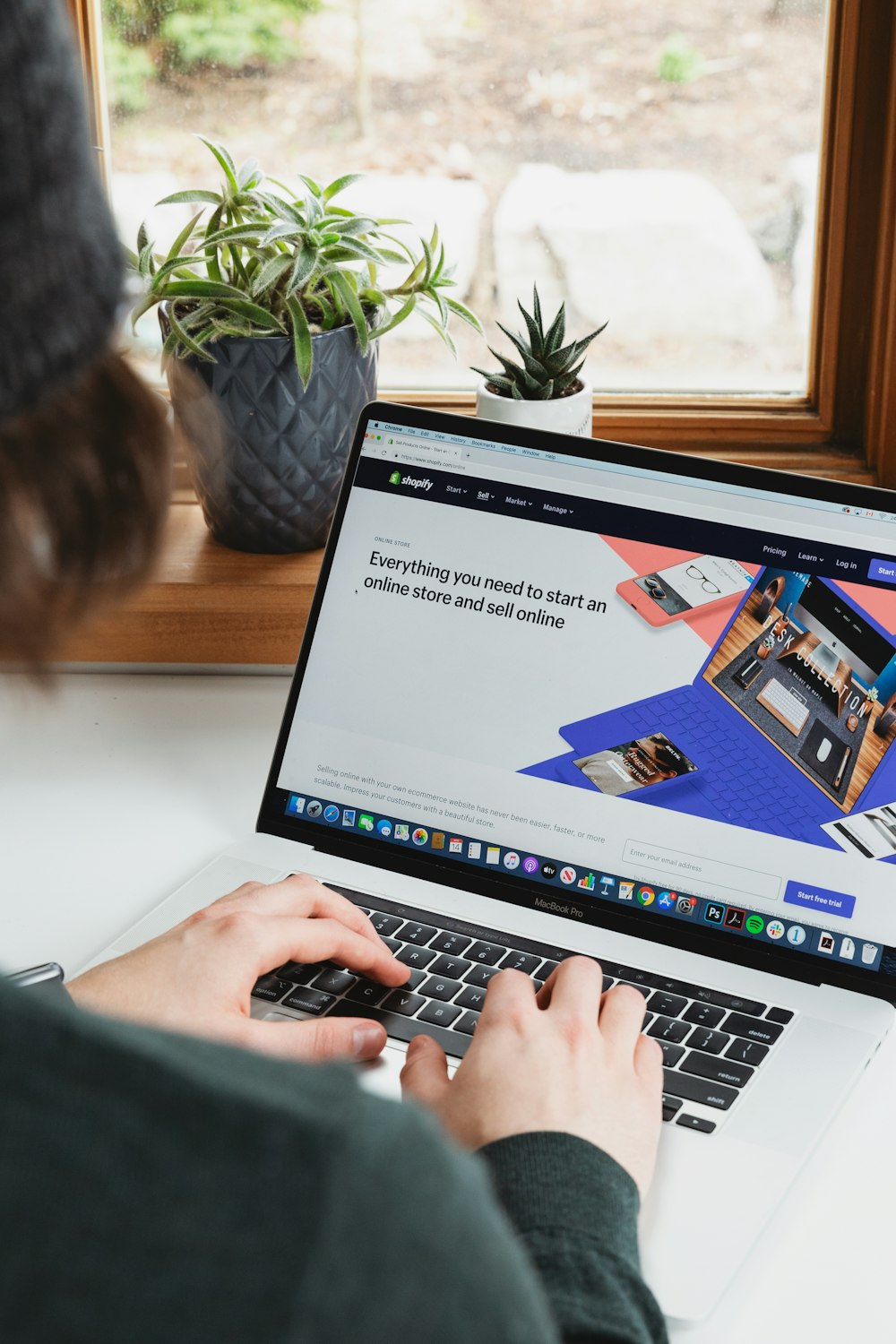 Person browsing a website on a laptop