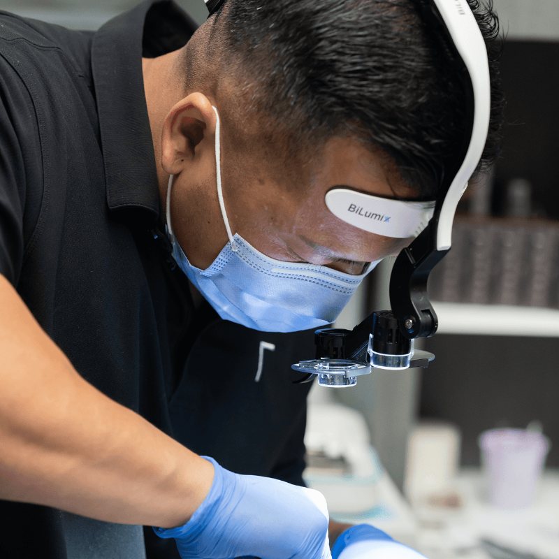 Dentist placing a dental implant
